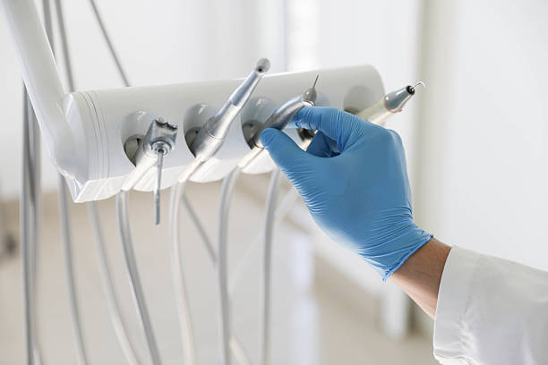 Professional Tooth Extraction technician working in Carson City, MI